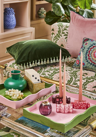 Pink and green wavy-edged bonbon tea light holder set of 3 with decorative items arranged on tray