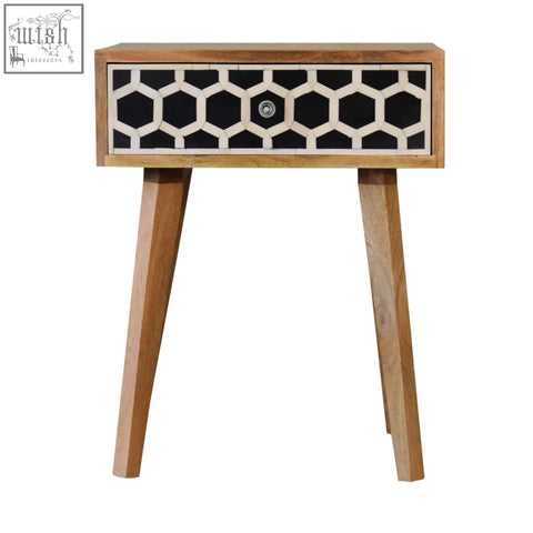 A modern tapered bedside table with bone inlay honeycomb drawer made of solid mango wood oak-ish finish