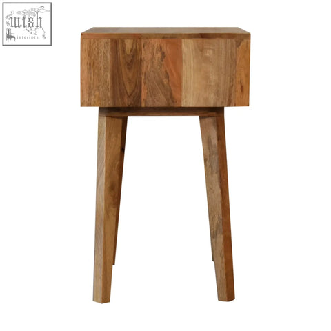 A rustic bone inlay tapered bedside table in warm brown solid mango wood with visible grain patterns and angled legs