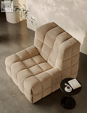 Beige corduroy bongani lounge chair with quilted blocky design perfect for living room lounge armchairs