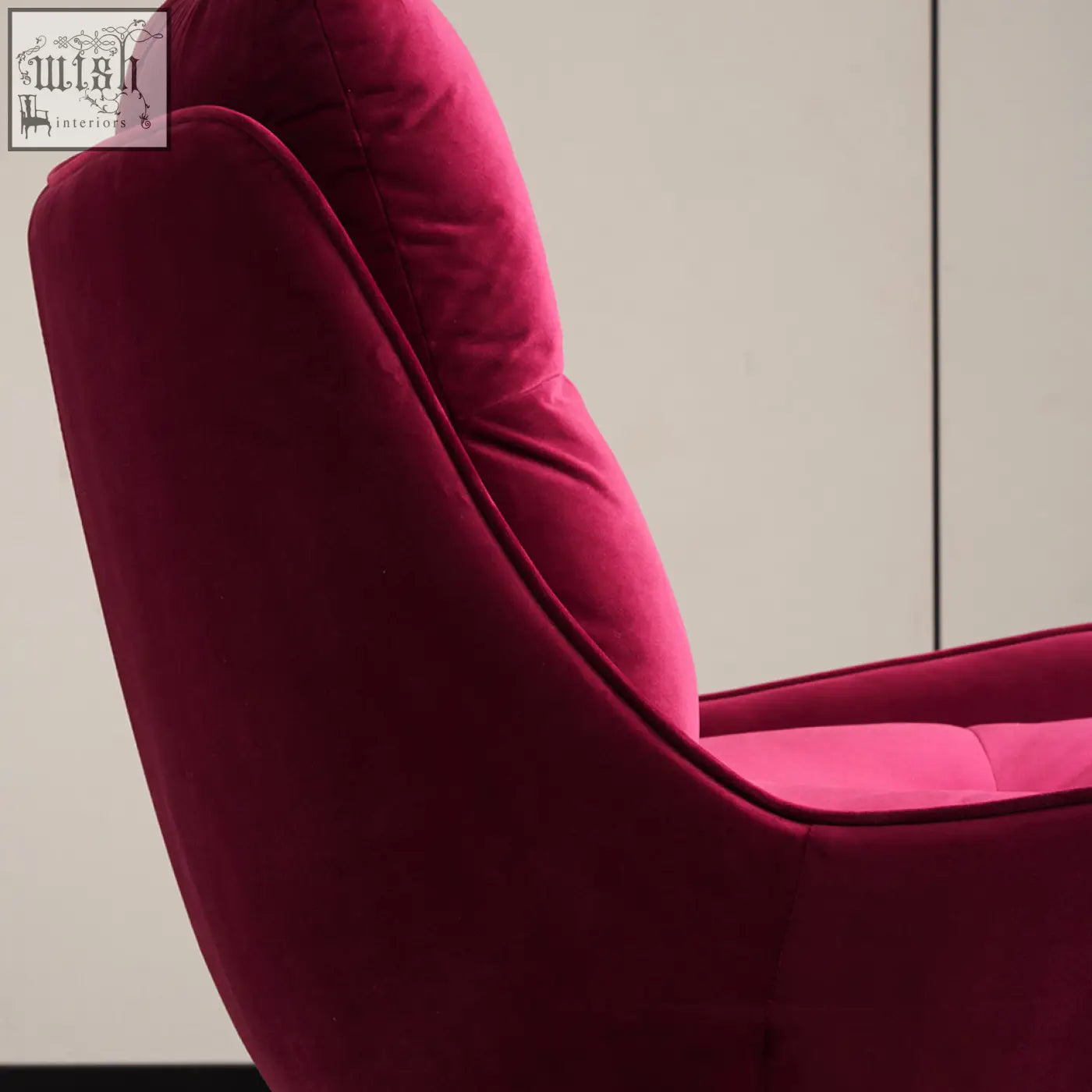A plush deep magenta velvet bonnet swivel lounge chair with sleek modern design perfect for relaxing spaces