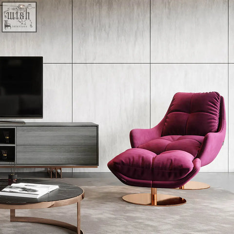 A plush deep magenta velvet bonnet swivel lounge chair with tufted design and rose gold swivel base