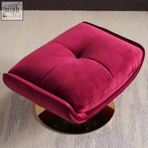 A plush fuchsia velvet ottoman with tufted design and gold base for bonnet swivel lounge chair setup