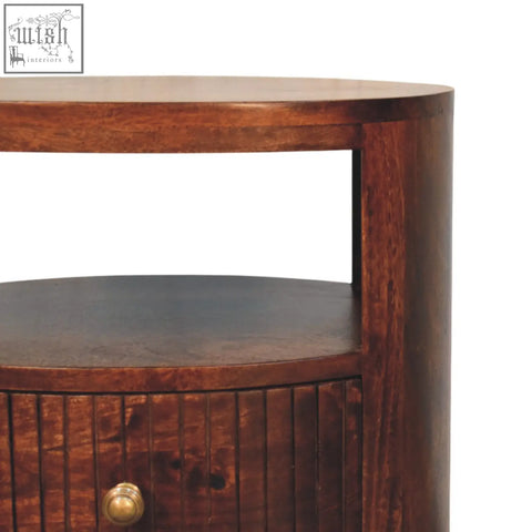Dark brown bordeaux bedside table with curved top and brass knob made from natural mango wood