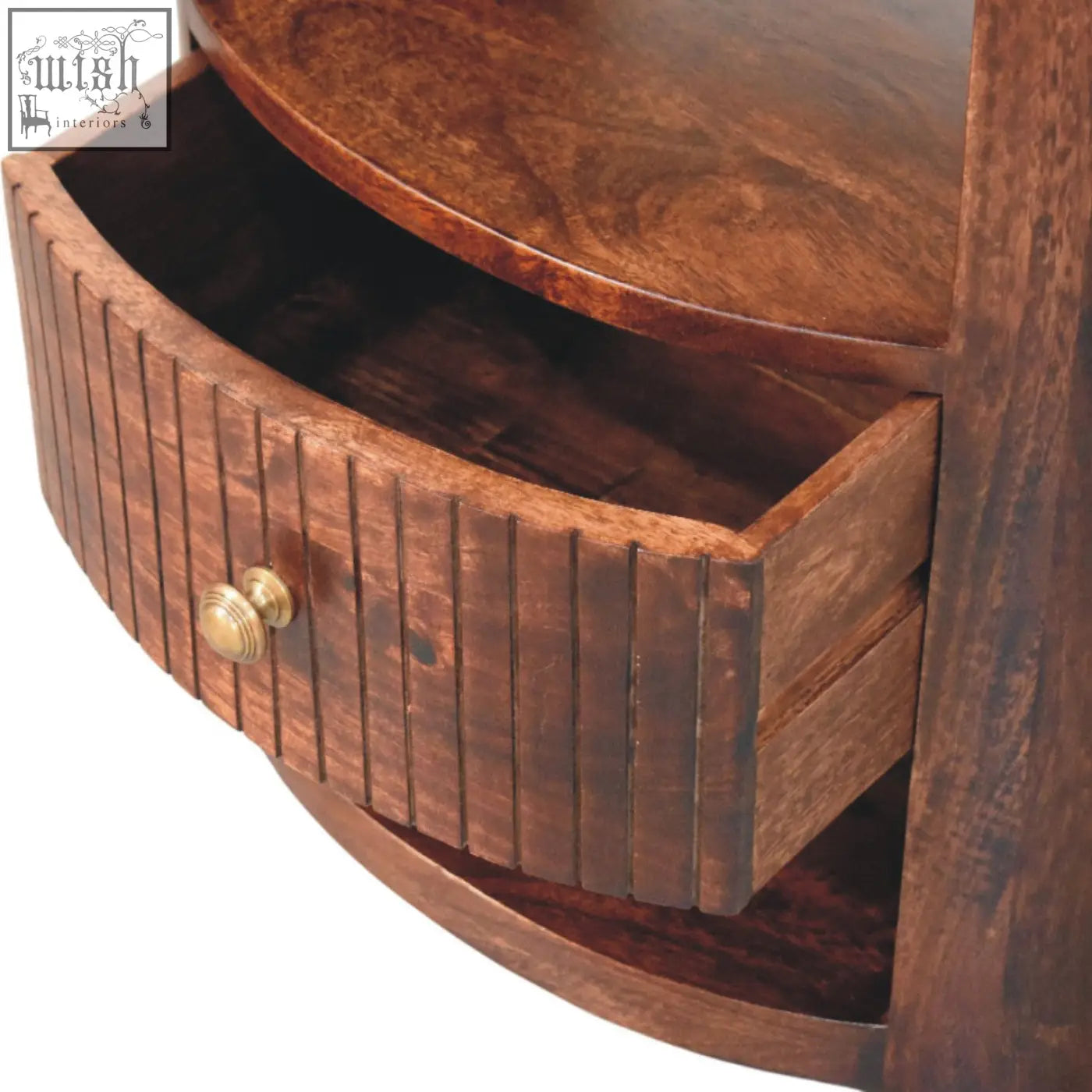 Rich brown bordeaux bedside table made of natural mango wood with curved drawer and brass knob for bedroom use