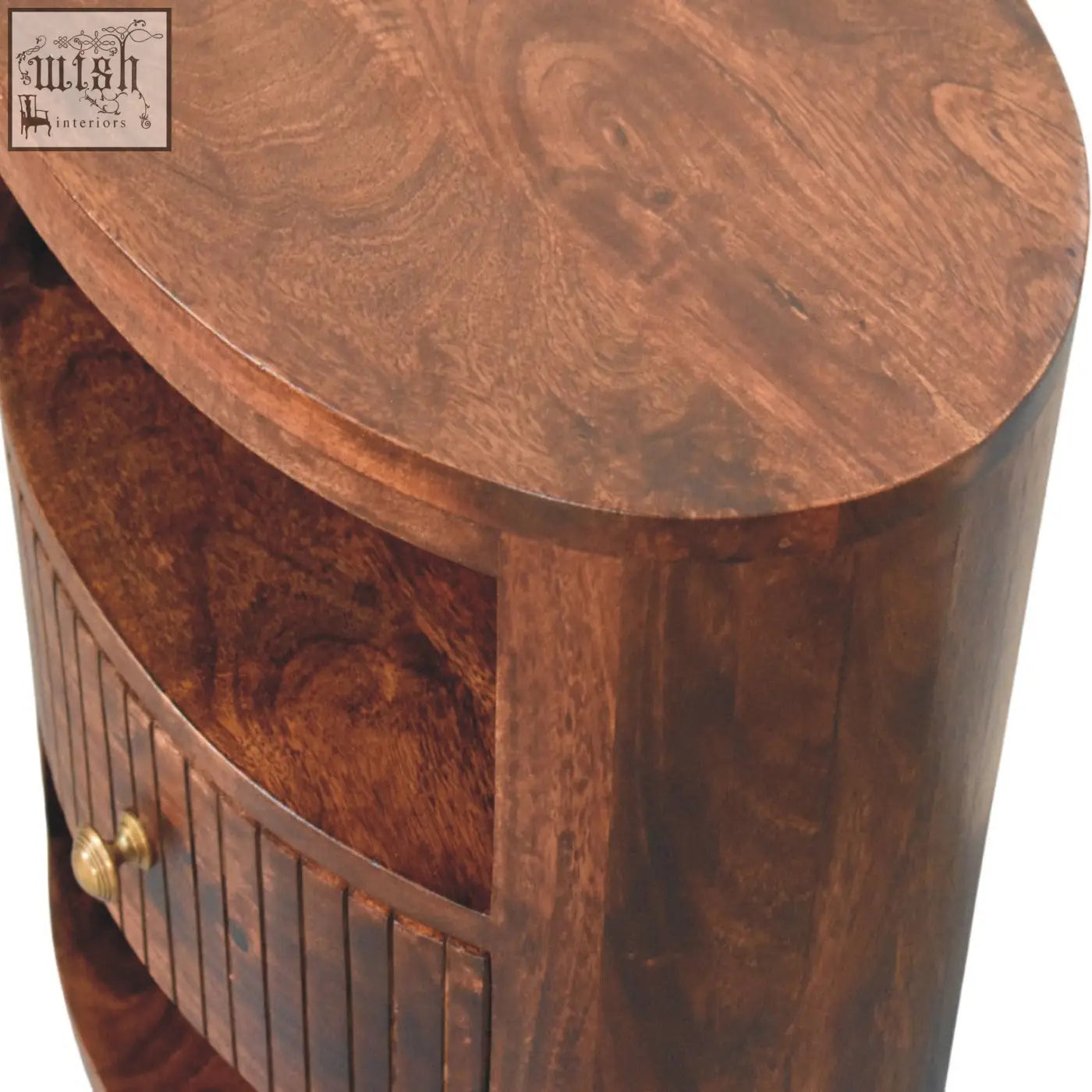 Rich dark brown bordeaux bedside table made of natural mango wood with smooth oval top and vertical slat paneling
