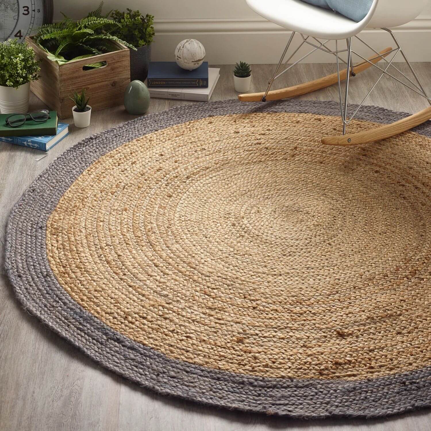 Round bordered grey jute rug with natural beige center and contrasting gray border handwoven from durable jute fibers