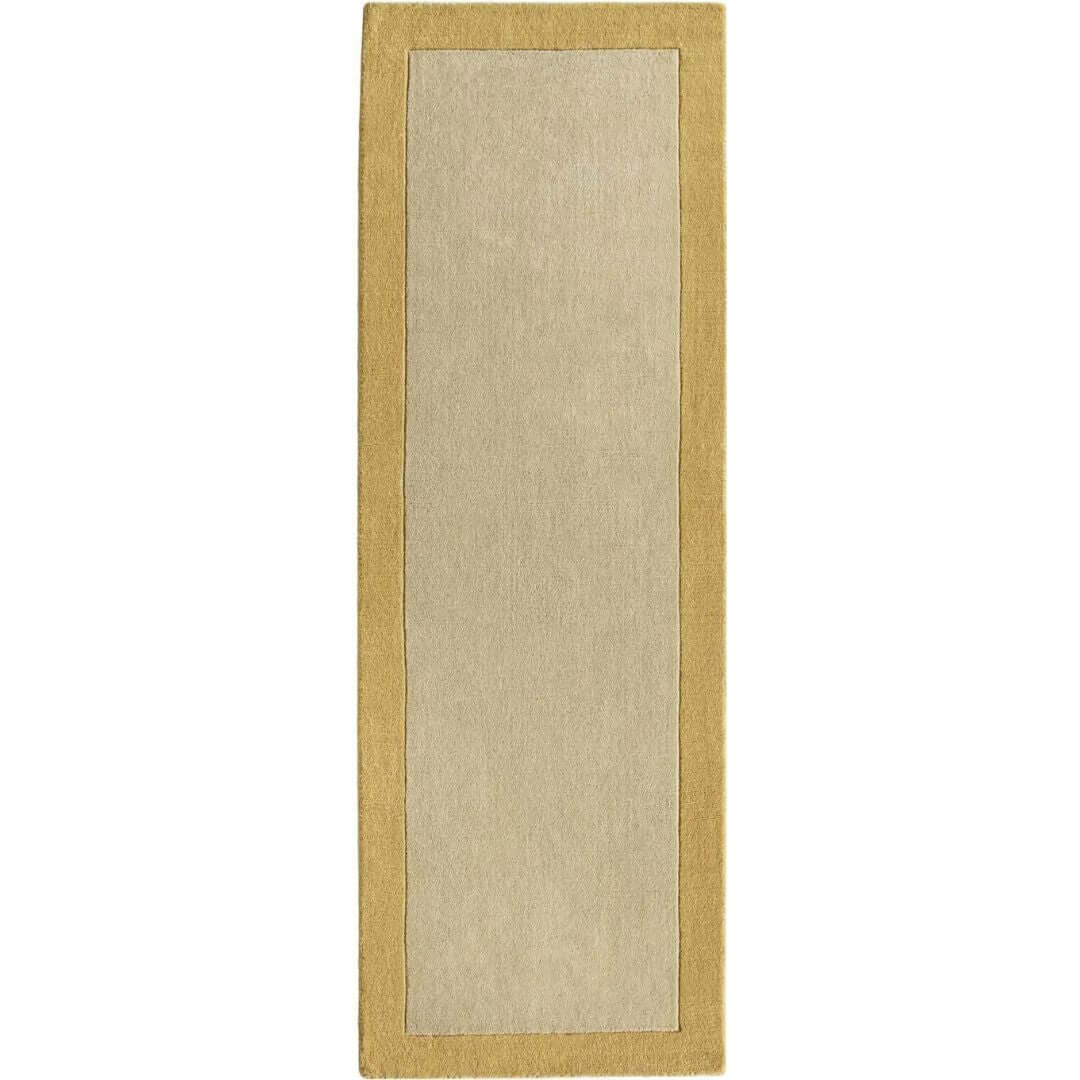 Beige rectangular bordered yellow wool rug with golden border perfect for cozy living spaces