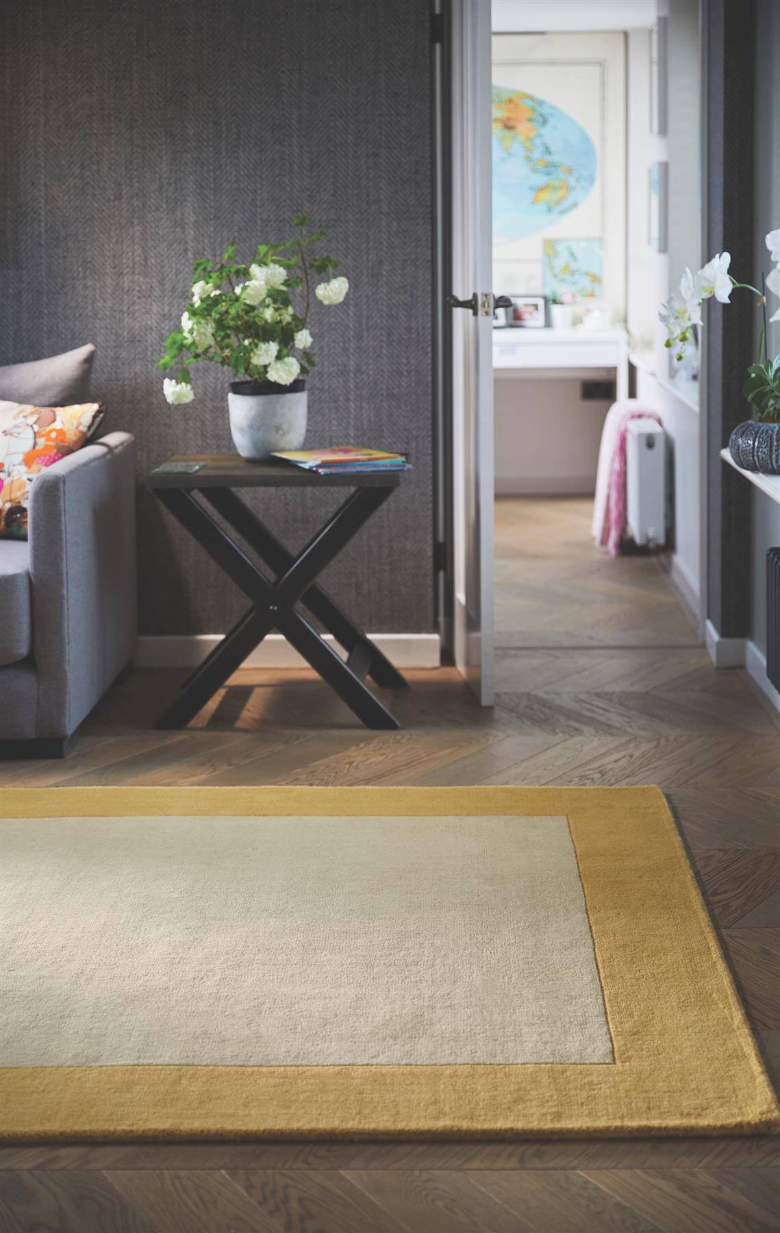Beige and mustard yellow bordered yellow wool rug with textured woven design perfect for cozy spaces
