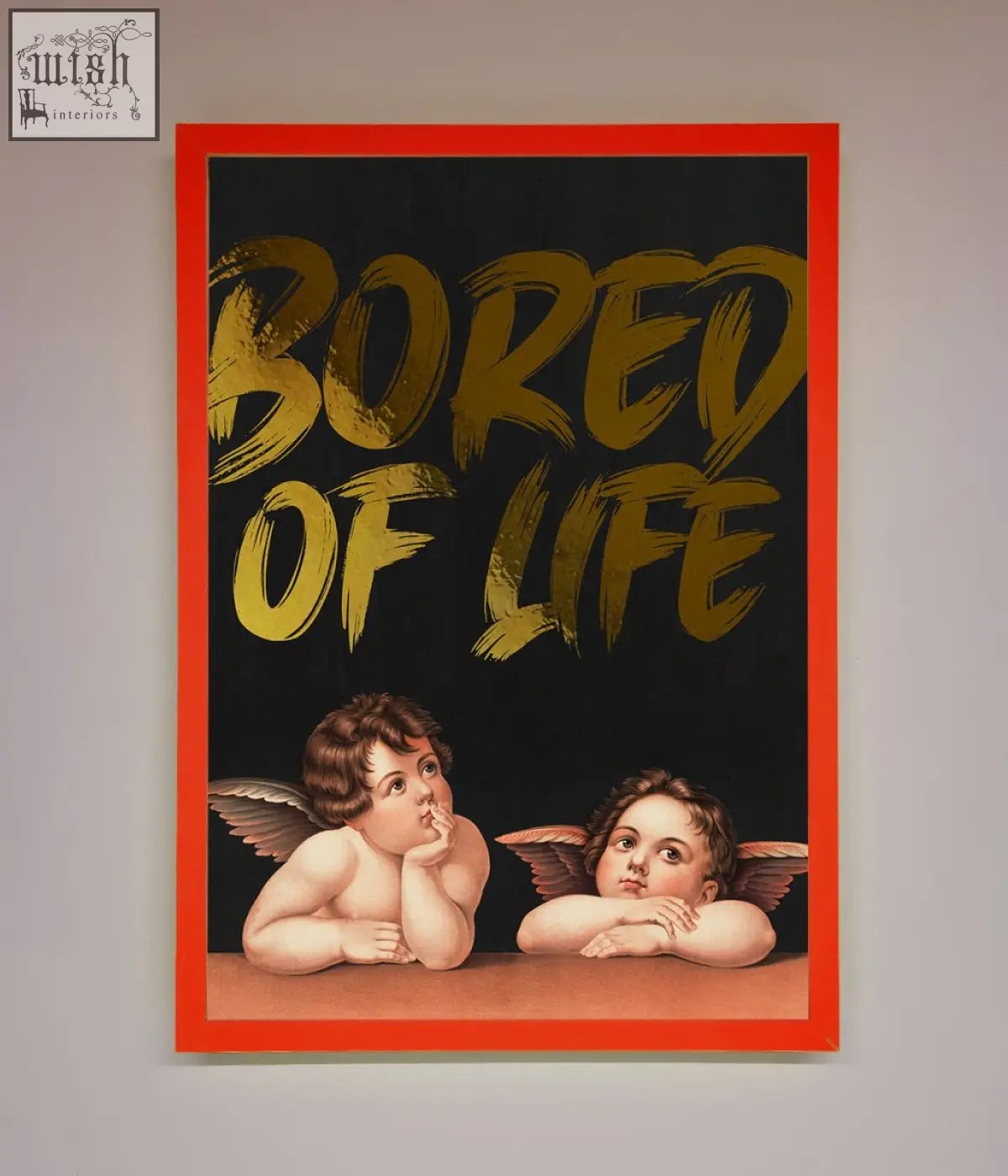 A framed red life foil print featuring two cherubs on black background with bold gold brushstroke lettering bored of life
