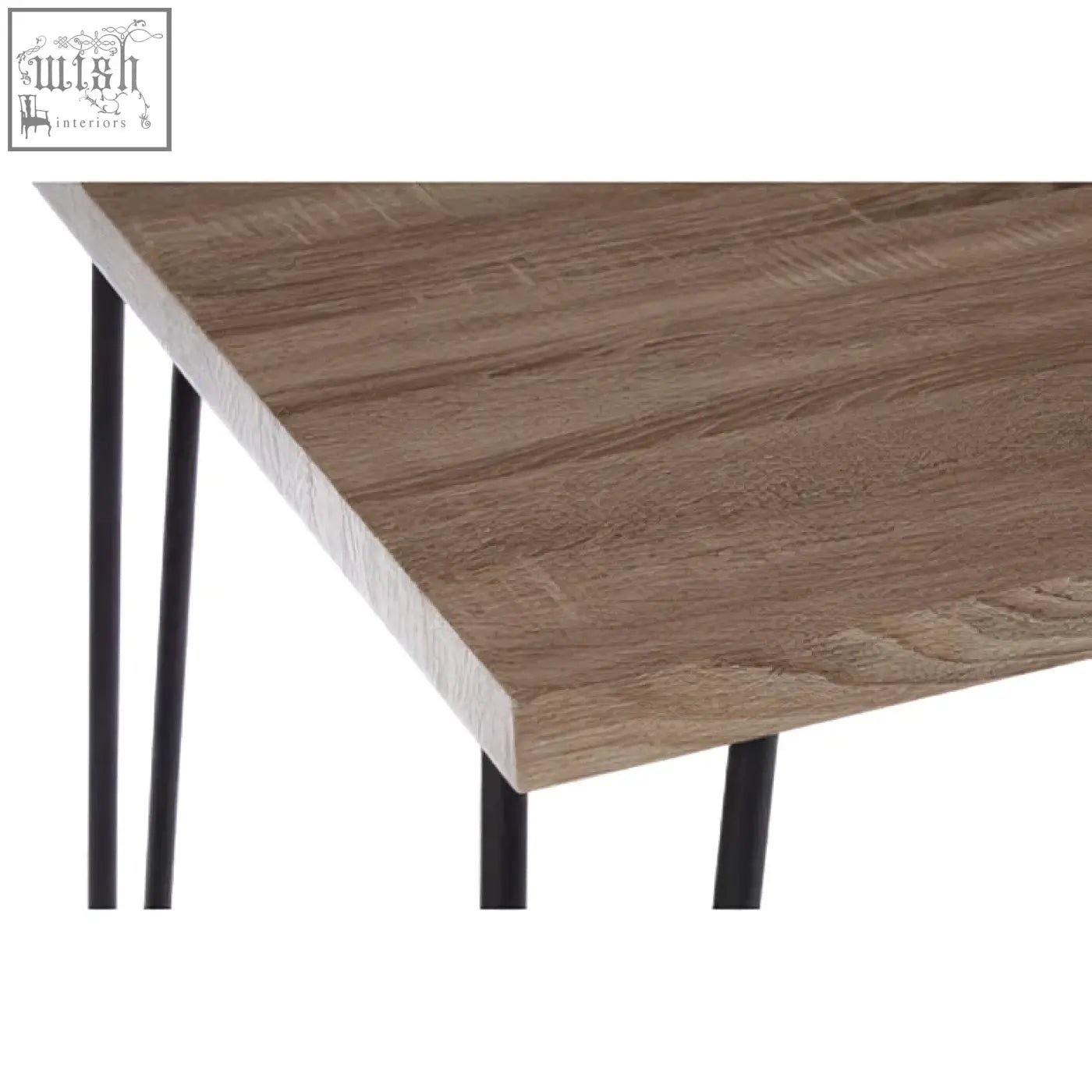 A modern dining table with a brown wood effect veneer top and black finish metal hairpin legs