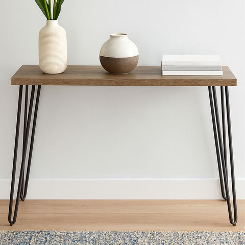Modern wooden console table with sleek black hairpin metal legs for stylish storage and decor display