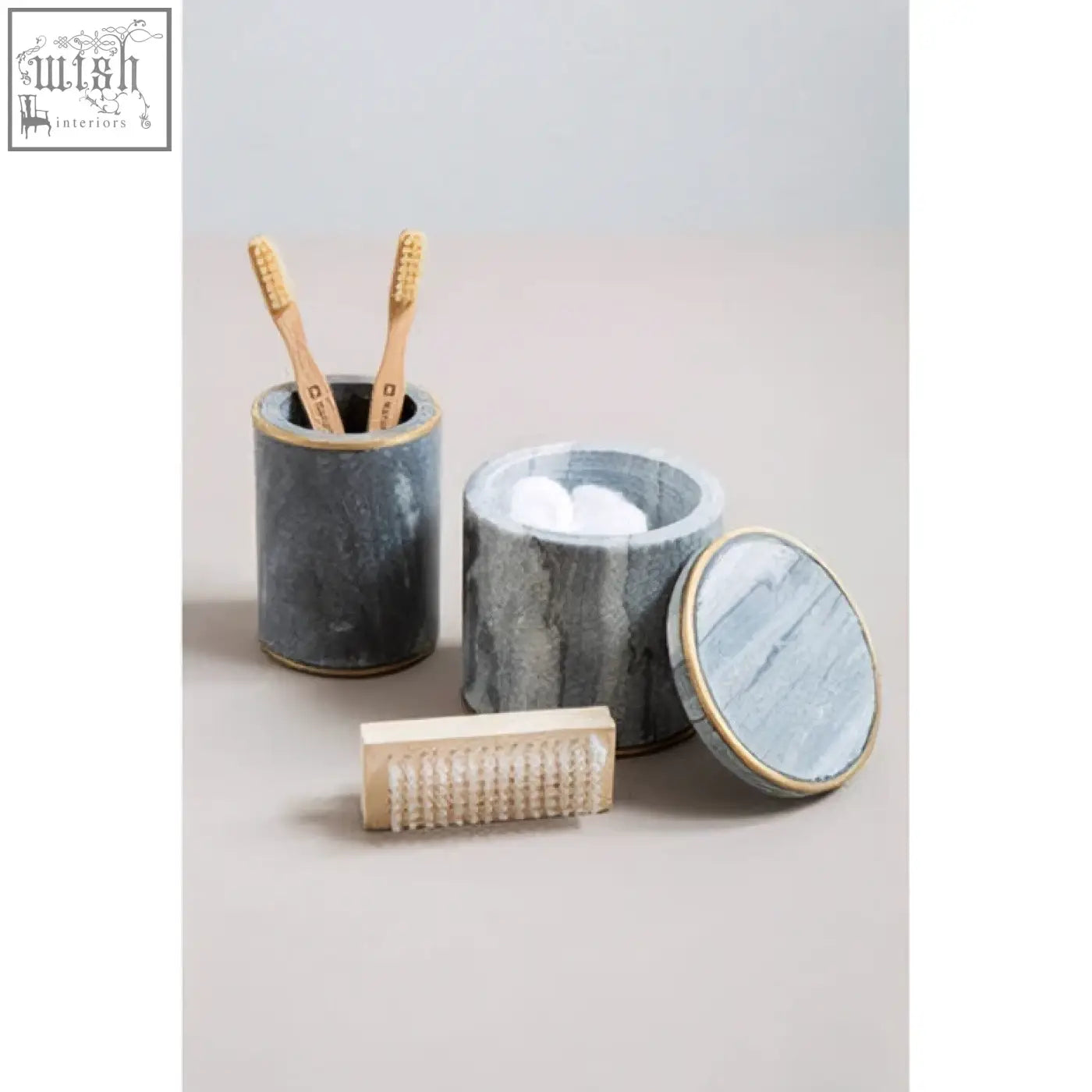 Bosco grey marble tumbler with gold rim holding two bamboo toothbrushes in a stylish grey marble toothbrush holder