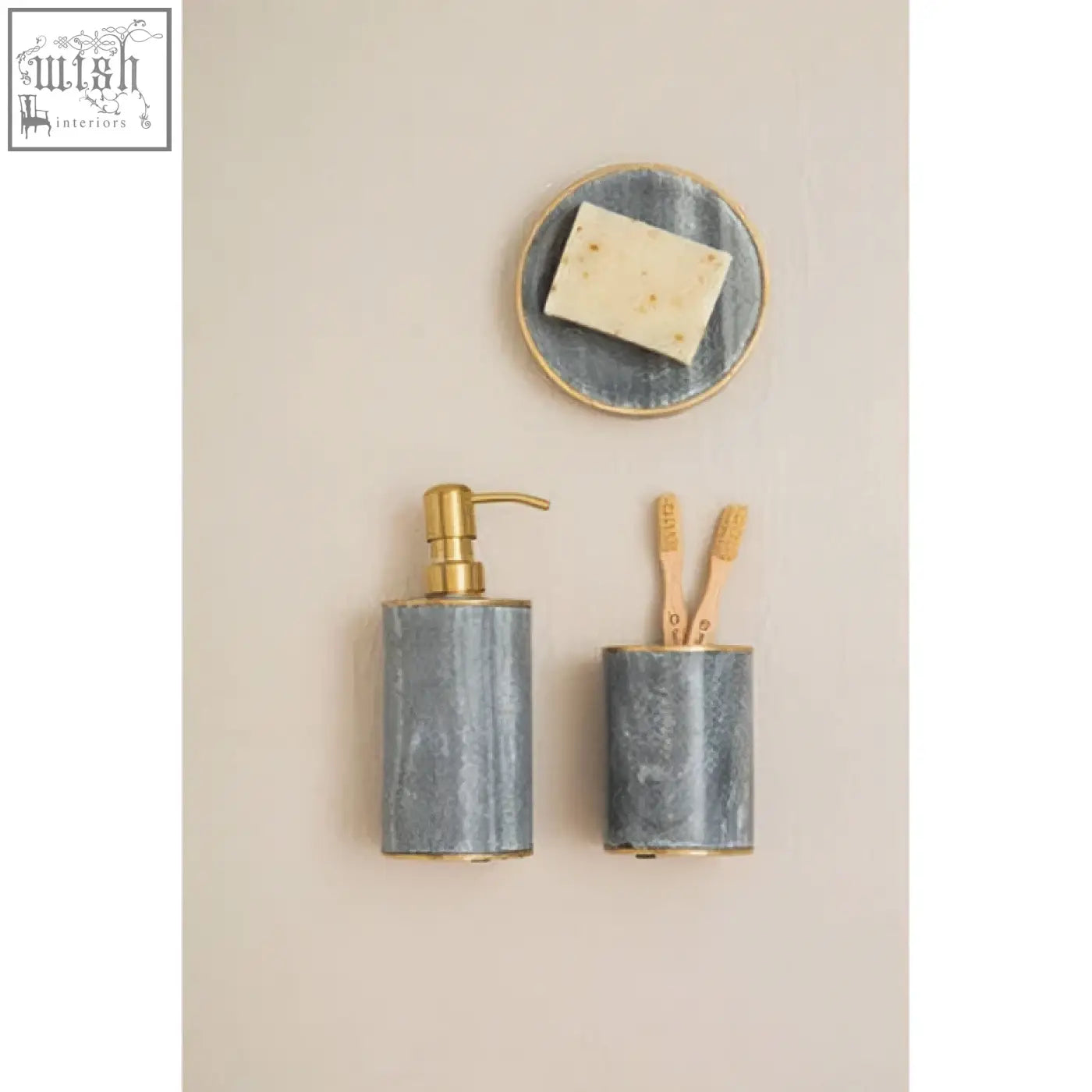 Gray metallic soap dispenser with gold-tone pump paired with bosco grey marble tumbler for stylish bathroom use