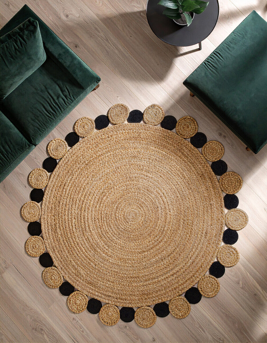 Large natural bosie demir black jute rug with beige center and alternating black and tan tassels on edge