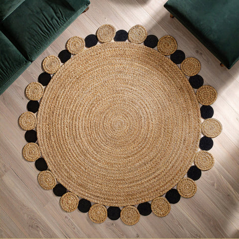 Natural fiber round black jute rug with woven jute center and beige black circular accents large natural design