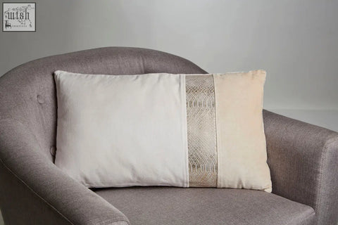 Beige bosie kensington townhouse rectangular cushion with a central vertical band of textured metallic gold lace