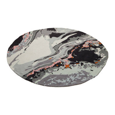 Bosie moyo round rug featuring a circular marbled design in gray black and soft pink perfect for cozy spaces