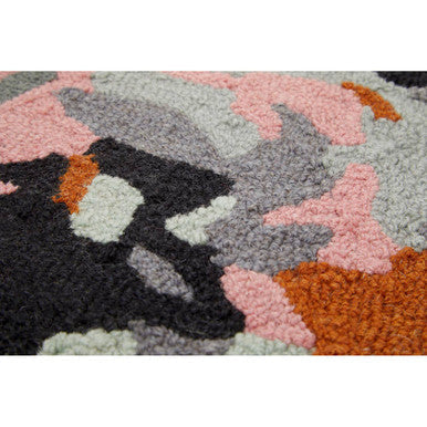 A plush bosie moyo round rug with a bold abstract pattern in pink gray black and orange perfect for living rooms