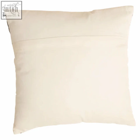 Cream-colored square pillow with subtle stitched seam featured as bosie ozella black and white embroidered cushion back view