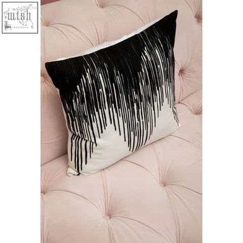 Bosie ozella black and white embroidered cushion featuring a sleek modern design with fringe accents perfect for decor
