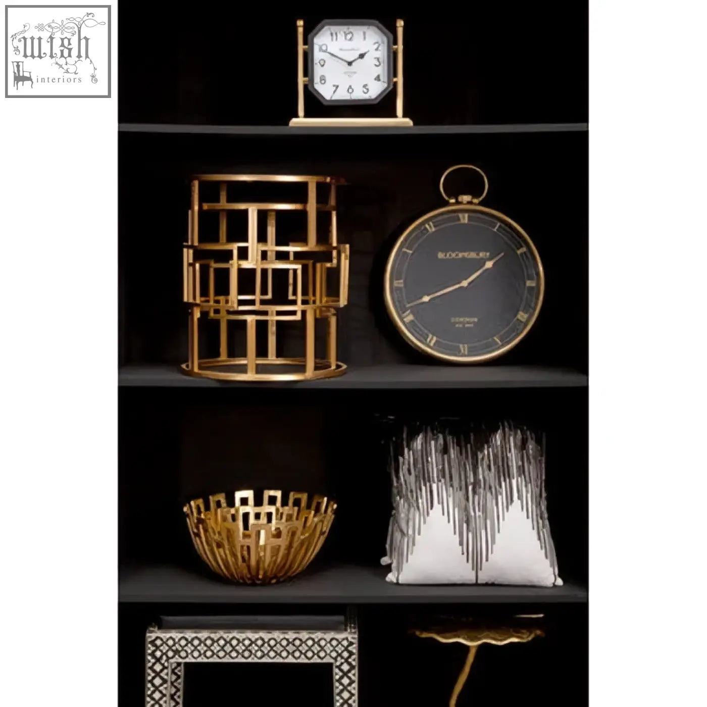Gold geometric lantern with modern lattice design and black accents next to bosie ozella black white embroidered cushion