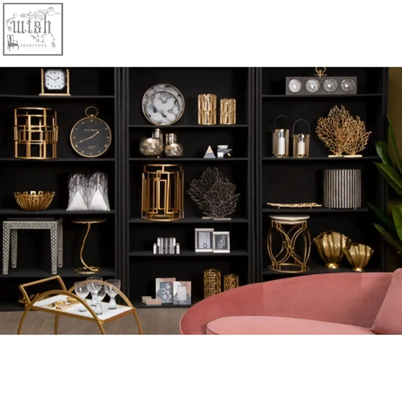 Gold-toned decorative lantern with intricate geometric patterns and clear glass shown alongside bosie ozella black white embroidered cushion