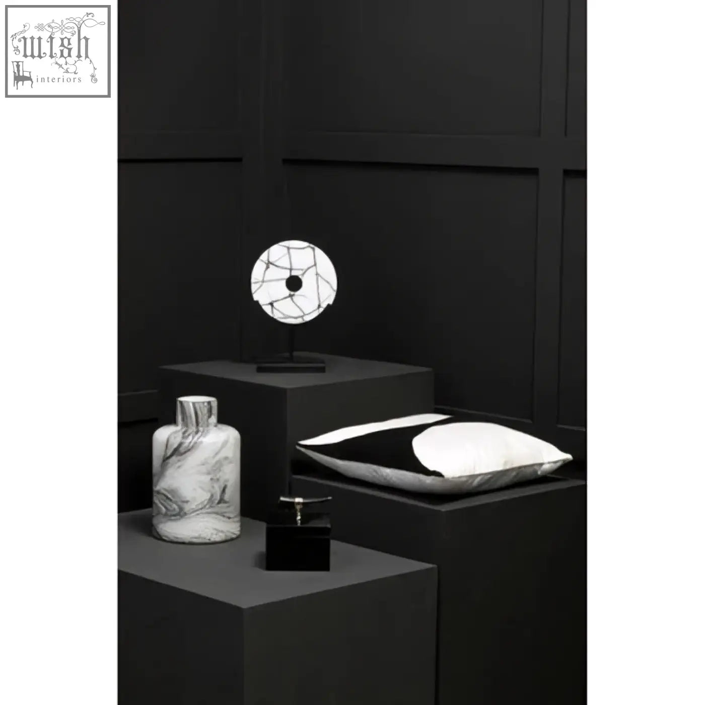 Black and white marble-patterned ceramic vase with slender neck complementing bosie ozella black cushion design