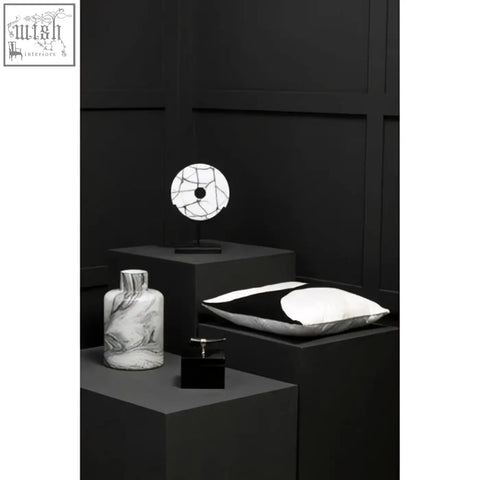Black and white marble-patterned ceramic vase with slender neck complementing bosie ozella black cushion design