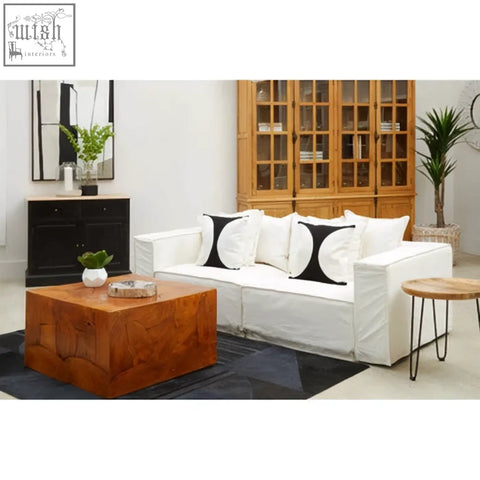 White upholstered sofa with bosie ozella black semi circular design black and white accent cushions