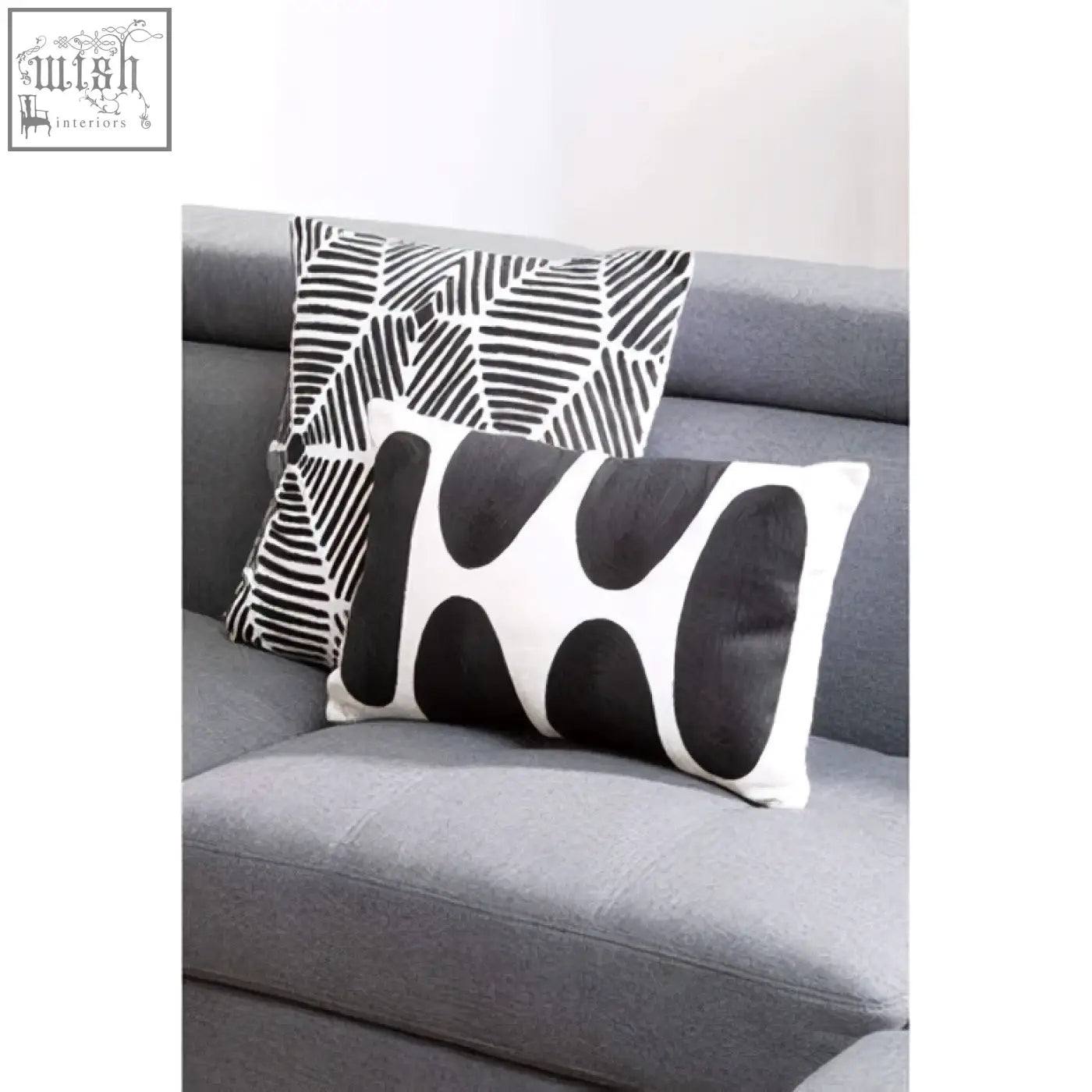 Bosie ozella black and white square embroidered cushion with bold geometric patterns on textured fabric surface