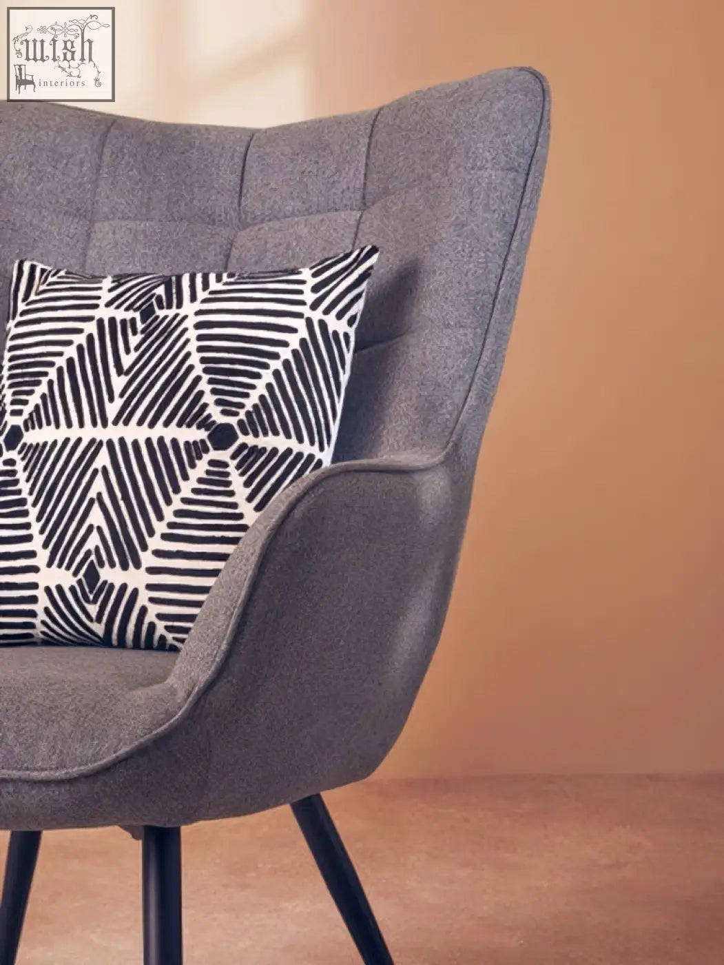 Gray tufted armchair with bosie ozella black and white square embroidered cushion for stylish comfort