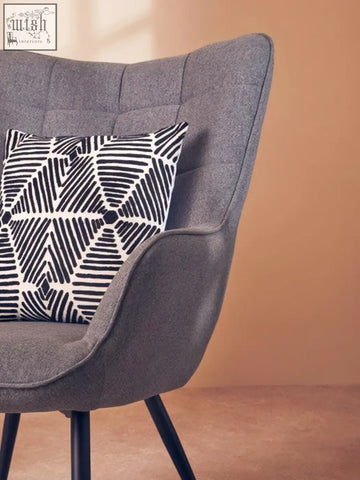 Gray tufted armchair with bosie ozella black and white square embroidered cushion for stylish comfort