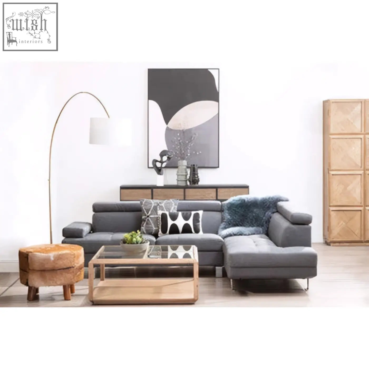 Gray sectional sofa with plush upholstery paired with bosie ozella black and white square embroidered cushion