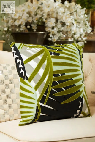 Bosie ozella botanical green cushion with vibrant green and black palm leaf pattern on light sofa as a green cushion