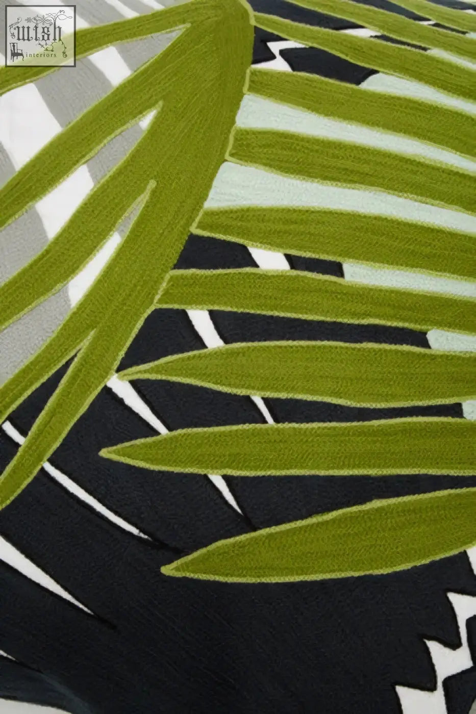 Bosie ozella botanical green cushion with vibrant lime green palm leaf pattern on black and white textured fabric
