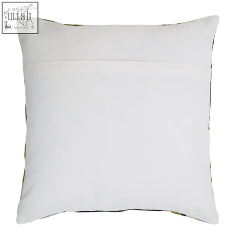 White square pillow with subtle green edge pattern in the botanical green cushion style by bosie ozella