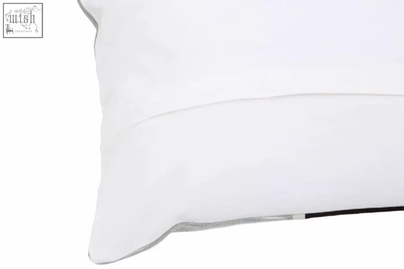 White pillow with subtle stitched seam and thin black trim from bosie ozella circular print embroidered cushion