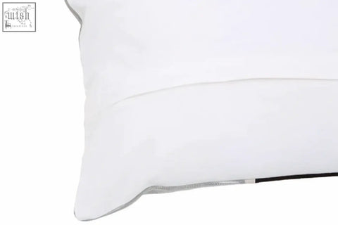 White pillow with subtle stitched seam and thin black trim from bosie ozella circular print embroidered cushion