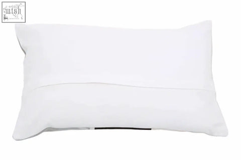 White rectangular pillow with smooth textured fabric and subtle stitching from bosie ozella circular print embroidered cushion