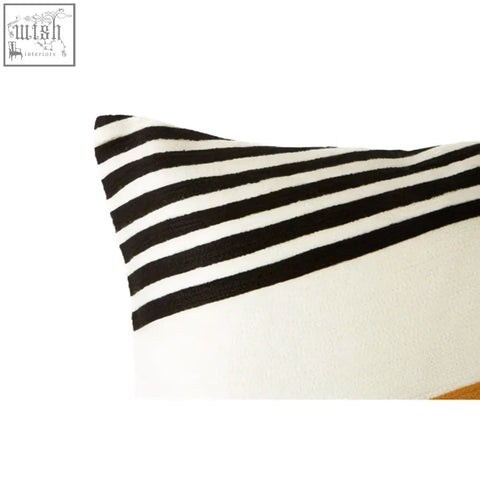 Rectangular bosie ozella diagonal design cushion with bold black and white horizontal stripes on textured fabric