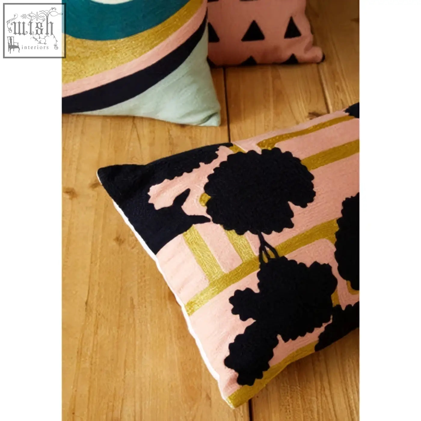 Pink bosie ozella floral design cushion with black embroidered floral patterns and gold stripes design cushion