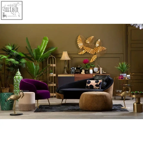 Purple velvet armchair with gold legs and matching ottoman featuring bosie ozella floral design cushion