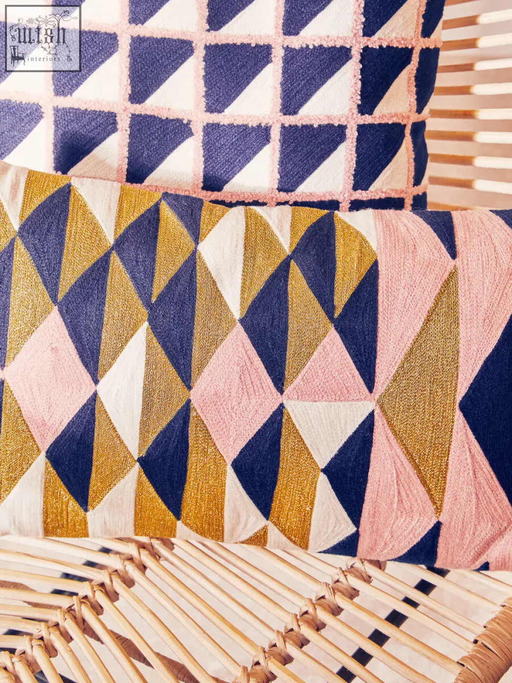 Bosie ozella grid design cushion with vibrant navy blue gold and blush pink geometric pattern on textured fabric