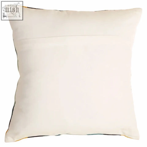 Cream-colored bosie ozella hexagonal design cushion with subtle stitching and soft plush fabric finish