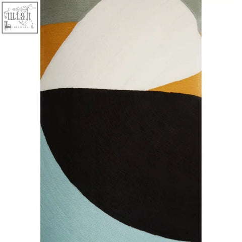 Bosie Ozella multi colour rectangular cushion with bold black white orange and light blue abstract geometric rug design