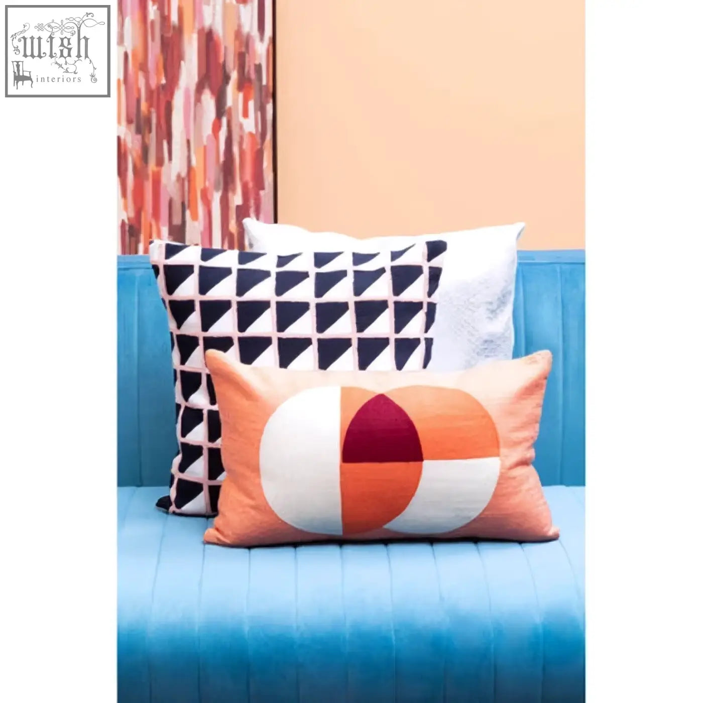 Bosie ozella multicolour rectangular cushion with a bold orange white geometric design and maroon cream circular segments
