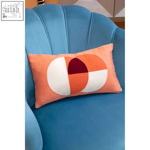 Bosie ozella multicolour rectangular cushion in peach with modern geometric circles in white orange and deep red