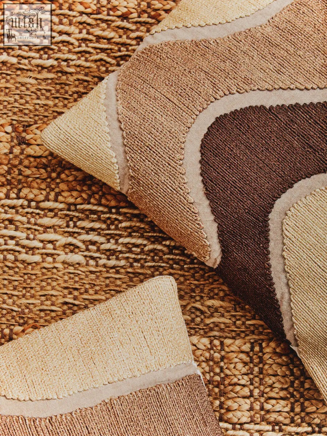 Bosie ozella natural tonal cushion with a textured patchwork design in beige tan and brown woven fabric