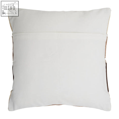 White square pillow with brown leather trim as a natural tonal cushion by bosie ozella natural tonal cushion